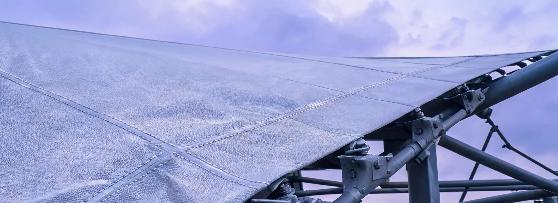 Tensioned architectural membrane roof viewed at the connection and seam details