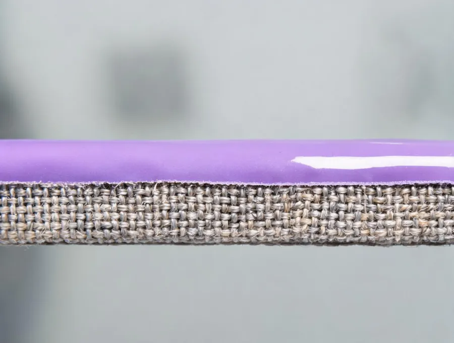 Uniform polymer coating layer on a technical textile
